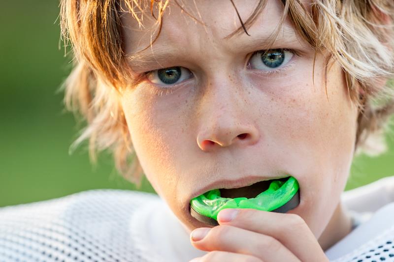 Custom mouth guard on teeth